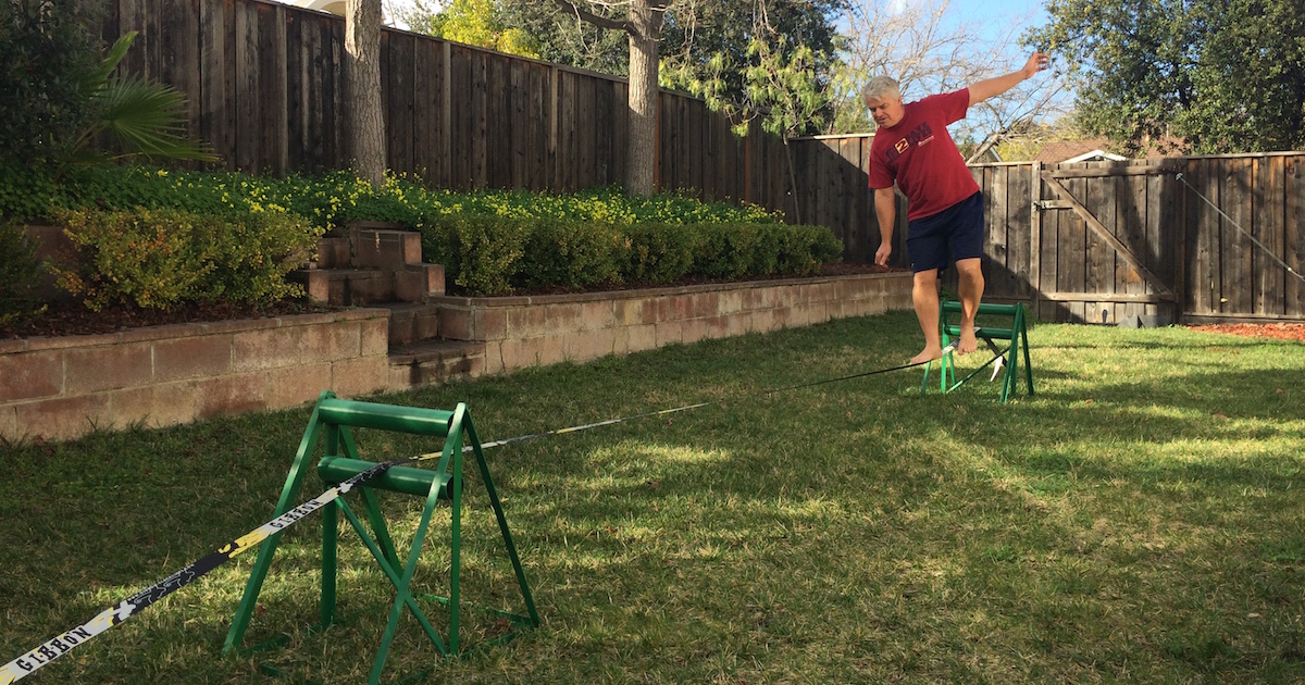 how to set up build setup a slackline with no trees without poles in the ground just lawn quitting sitting slack line in action featured image
